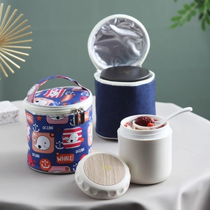 Close-up of insulated 304 stainless steel soup cup with whale pattern thermal carry bag