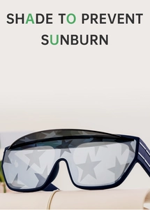 Detailed view of square blue oversized sunglasses featuring a silver star lens pattern