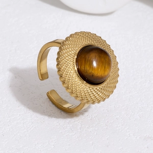 Macro shot of 18k gold plated stainless steel ring featuring a central tiger eye stone