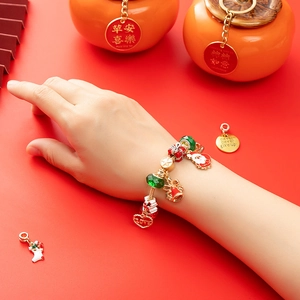Festive Christmas charm bracelet with Santa Claus and enamel pendants on gold snake chain