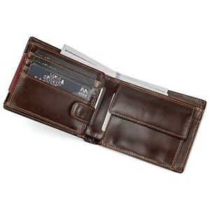 Detailed interior of a vintage dark brown leather trifold wallet showing slots and coin pocket