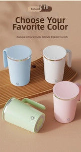 Top view of portable self-stirring coffee mugs in four pastel colors on a wooden tray