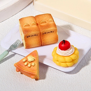 Miniature cat-themed resin food models with toast and cake on a white plate