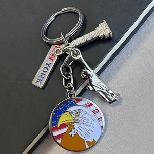 Detailed view of New York souvenir keychain with Statue of Liberty and enamel eagle charm