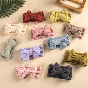 Set of 11 multi-color elastic ribbed knit baby headbands with large handmade bow knots