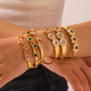 Stack of 18K gold-plated titanium steel heart bangles with colorful zircon and sea shell