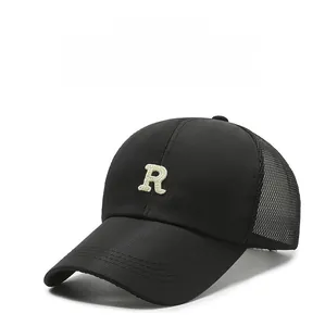 Detail of breathable black mesh back and cream R embroidery on quick-dry baseball cap