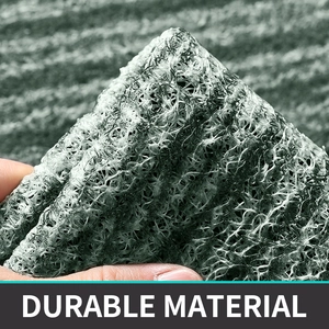 Macro shot of durable gray and white PVC wire loop doormat showing thickness and flexibility