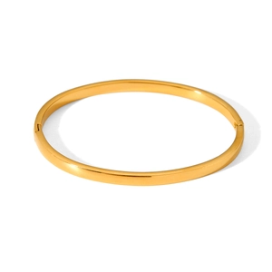 Detailed view of a minimalist gold-plated stainless steel bangle with a hinge closure