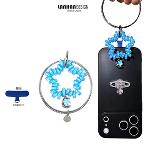 Detailed view of blue star-shaped bead phone strap with cosmic charms and ring connector