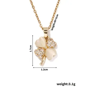 Detailed view of four-leaf clover pendant with cat-eye stones and 40+5cm chain