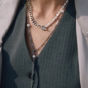 Elegant multi-layer stainless steel pearl necklace with T-bar clasp on female model