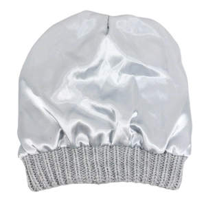 Detailed close-up of the smooth silver satin lining and grey knit edge of the beanie