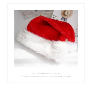 Close-up of soft red and white plush fabric on a classic festive Christmas hat