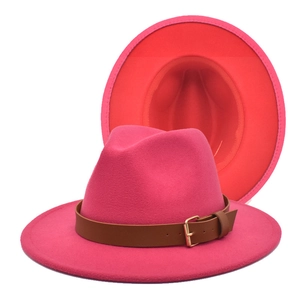 Two-tone wide brim fedora in bright magenta wool felt with decorative brown leather buckle band