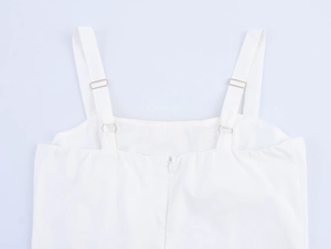Detail view of the white beach dress back featuring adjustable straps and a hidden zipper