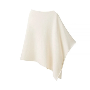 Minimalist beige asymmetric knit poncho sweater wrap for women in a clean studio shot