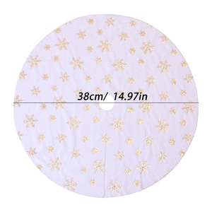 Detailed view of white plush Christmas tree skirt with gold sequin snowflakes, 38cm diameter