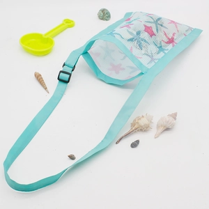 Adjustable mesh kids beach shell bag with starfish print and blue trim for summer toys