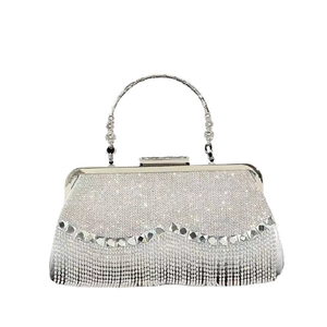 Elegant silver evening clutch bag with sparkling rhinestones and fringe tassels on white background
