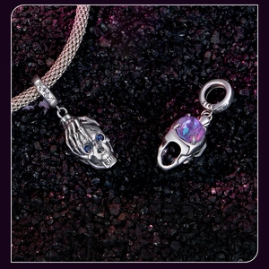 Macro shot of S925 sterling silver skull beads with purple and blue gemstones