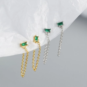 Detail of s925 silver fringe earrings with green crystals and chain tassel style