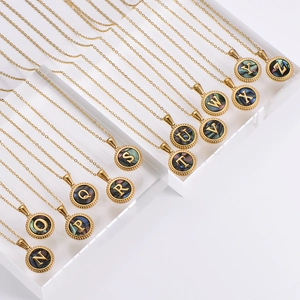 Gold stainless steel round pendant necklace collection featuring colorful shell alphabet N-Z