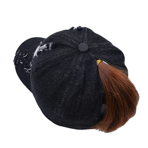 Black distressed denim ponytail baseball cap with washed ripped design for women