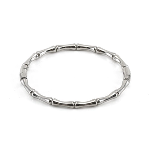 Polished silver bamboo-style stainless steel bangle with minimalist segment design