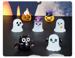 Miniature Halloween resin decor set with ghost and pumpkin figurines on black leather
