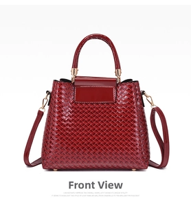 Front view of burgundy woven texture handbag with glossy finish and gold metal hardware