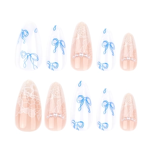 Blue bow almond nails with white lace patterns and pearl accents on 10pcs set