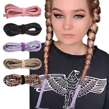 Detail showing various colors of heatless hair curlers and how to wear them on hair