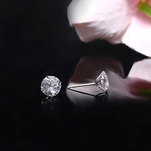 S925 sterling silver four-prong stud earrings with round cubic zirconia on black background