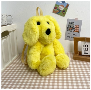 Detail of soft yellow plush dog backpack with fluffy texture and adjustable straps