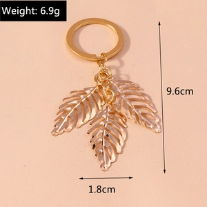 Golden hollow leaf alloy keychain showing a 9.6cm length and 6.9g lightweight design