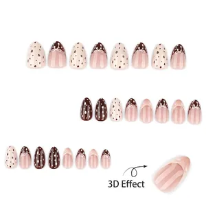 Braune künstliche Nägel in Mandelform mit 3D-Bögen und Polka-Dot-Mustern