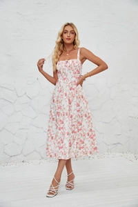 Detailed view of white floral summer midi dress with pink flower print and ribbon tie front