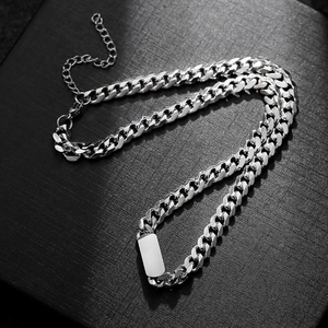 Detailed view of silver titanium steel Cuban chain necklace with blank ID tag plate