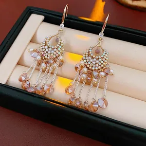 Zircon tassel pearl earrings with bohemian moon design in vintage gold finish