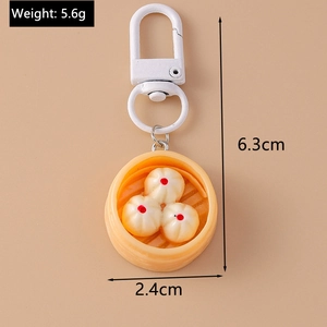 Detail view showing dimensions of a funny steamed bun dumpling keychain with 6.3cm height