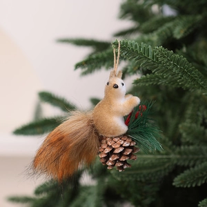 Detail of Christmas tree ornament featuring a fuzzy squirrel on a natural pine cone