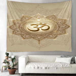 Detail of bohemian mandala tapestry with Om symbol hanging above a cozy white sofa