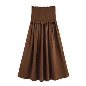 Women's brown smocked waist maxi skirt with pleated texture and bohemian style