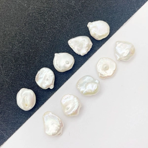 Set of 9 irregular baroque freshwater pearls with high luster on black and white background