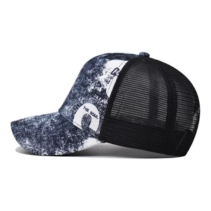 Classic black and white trucker hat with gradient printed pattern and mesh back