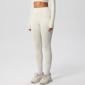 Detail of cream high-waisted yoga pants with side pockets and long sleeve gym top set