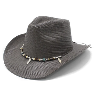 Detail of dark brown cowboy straw hat with ethnic bead band and silver feather charms