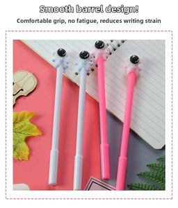 Close-up of cute 3D astronaut toppers on sleek pink and white creative gel pens