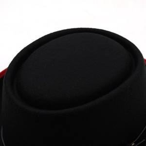 Close-up of a classic black felt bowler hat with a premium textured round crown